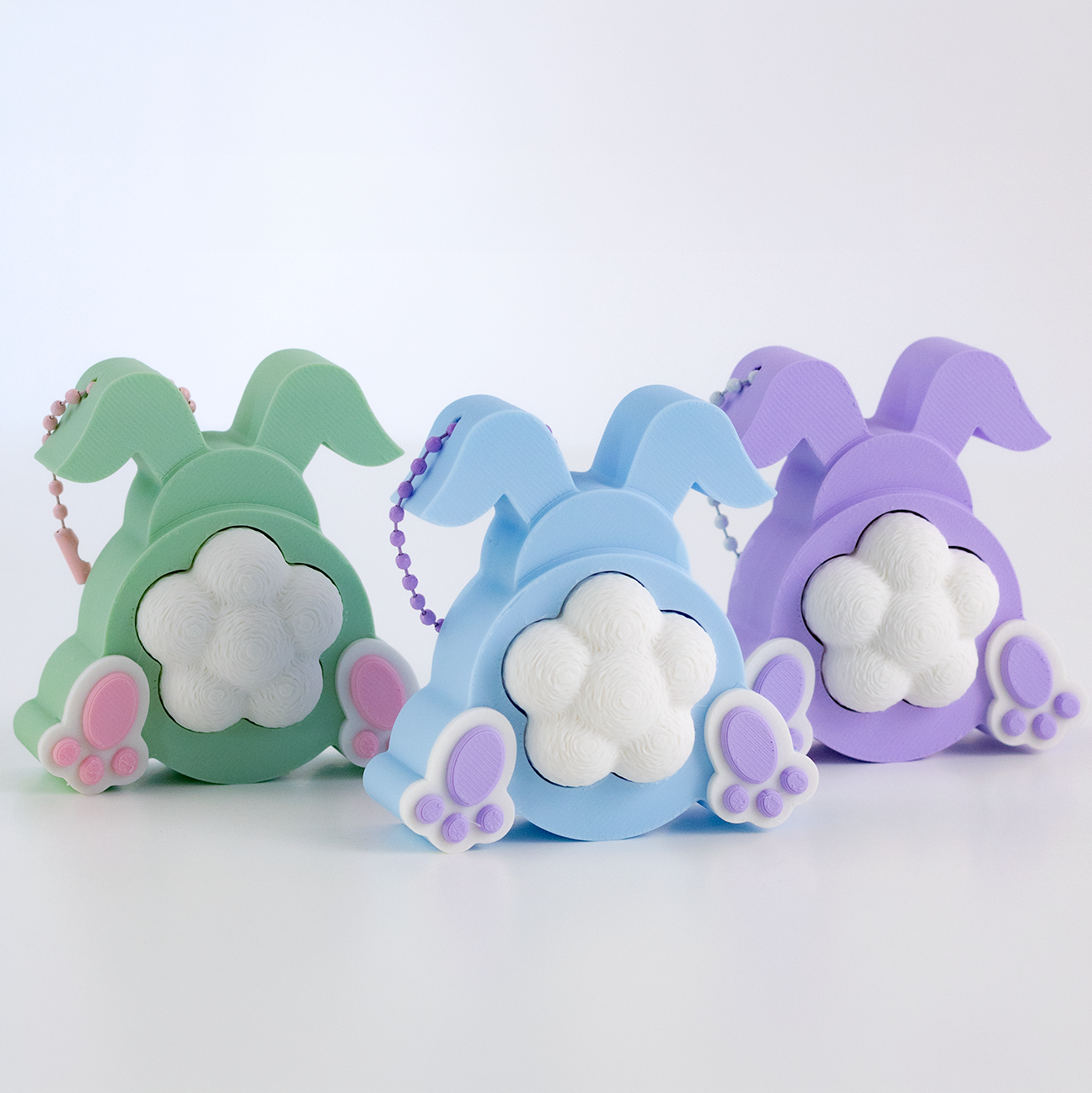Porte-clés lapin pastel avec clicker anti-stress imprimé en 3D